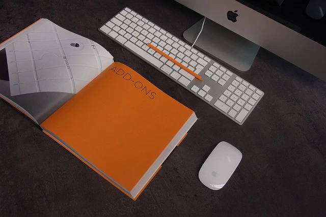 Ergonomic desktop workspace with wireless keyboard and productivity notebook — ideal home office setup for 2025 professionals.